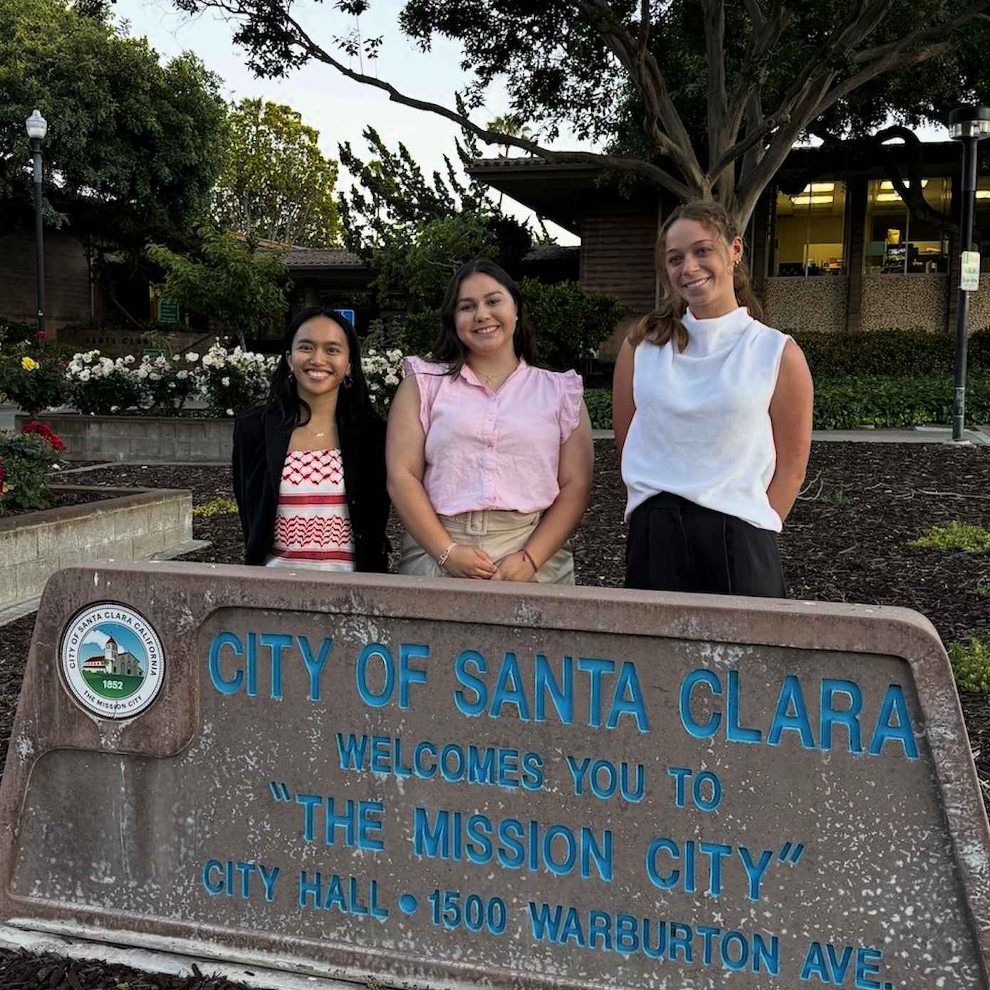 3 SVP SF Fellows posing behind the City of Santa Clara sign at City Hall